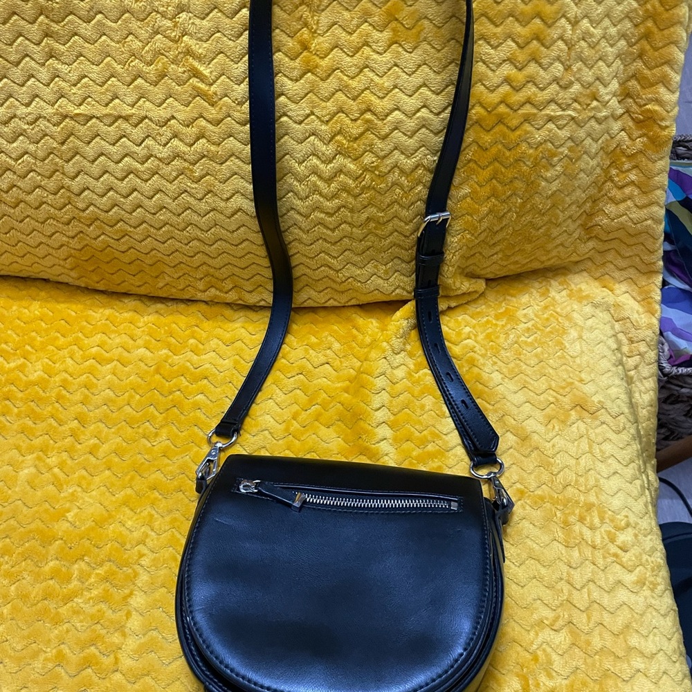 Rebecca Minkoff purse. Pocket slightly ripped. Otherwise good condition